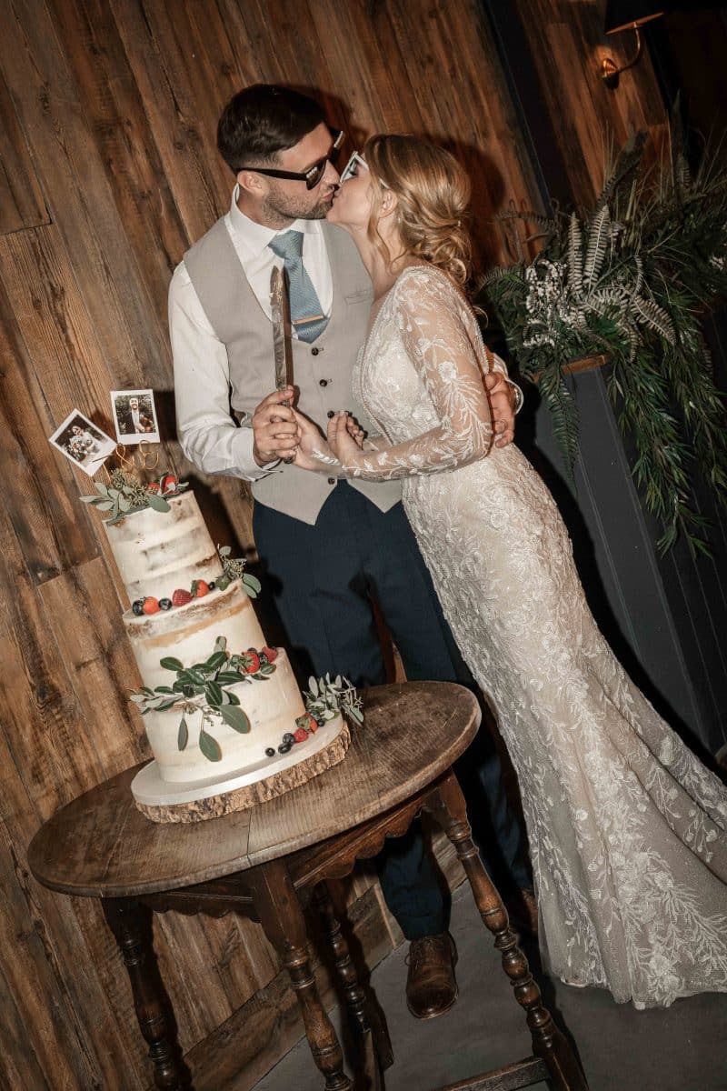 cake cutting cool wedding photos | Wedding photographer for Silchester Farm in Berkshire, wedding photographer in Hampshire